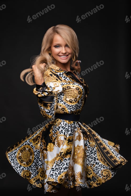 Preview: Attractive blonde wearing elegant dress and accessories