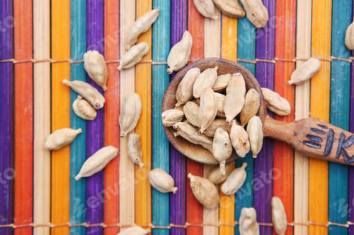 Preview: close up of Cardamom on a spoon on table