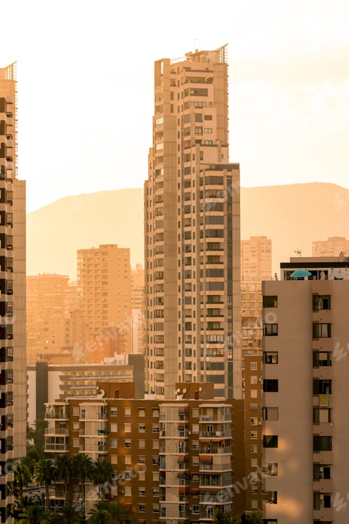 Preview: Residential buildings against sunset sky