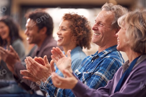 Preview: Group Of Casually Dressed Businessmen And Businesswomen Applauding Presentation At Conference