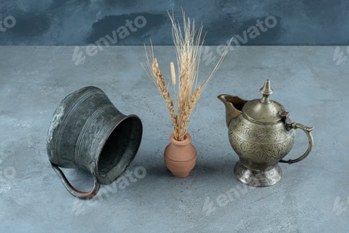 Preview: Rice plant with metallic kettle around on a blue background