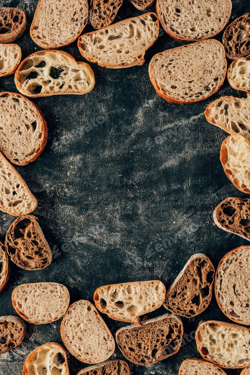 Preview: top view of arranged pieces of bread on dark tabletop with flour