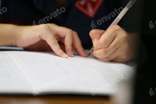 Preview: Working woman signing on documents paper closeup on table blur background concept of working women
