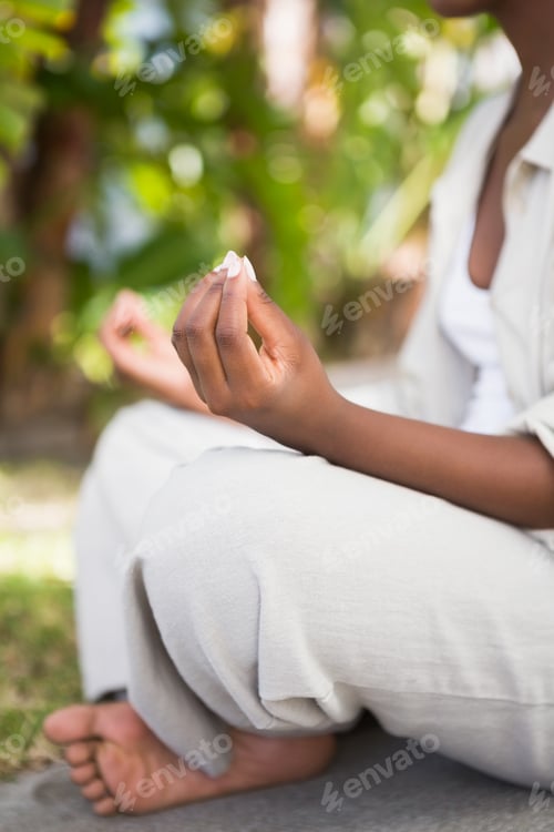 Preview: A young woman doing yoga over white backgroung