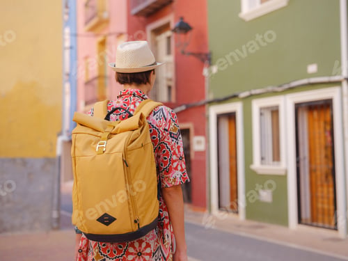 Preview: Woman strolls through colorful streets of Spanish coastal town
