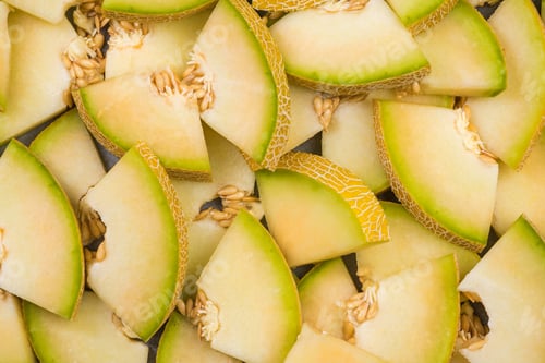 Preview: Honeydew melon slices, full frame food background
