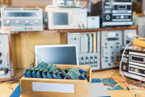 Preview: Close-up electric green embedded microcircuits in production