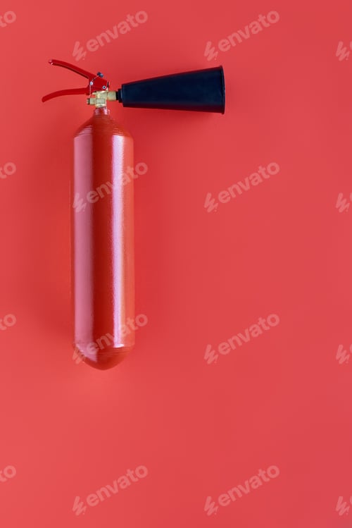 Preview: top view of red fire extinguisher isolated on red
