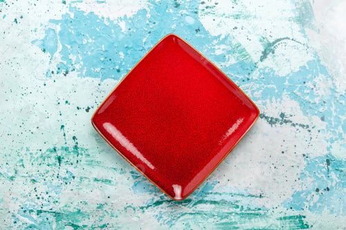 Preview: top view red plate square formed empty on light blue background plate kitchen food color