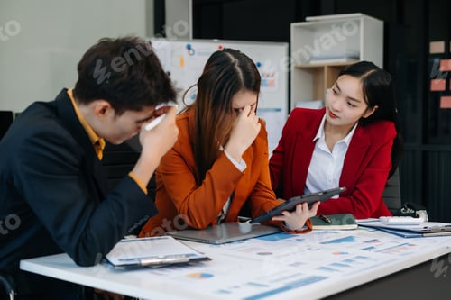 Preview: Businessman team working are under stress from financial data and report graph.