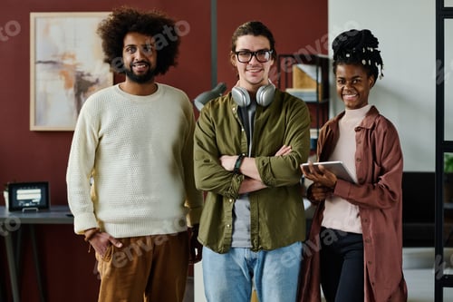 Preview: Three happy intercultural office workers