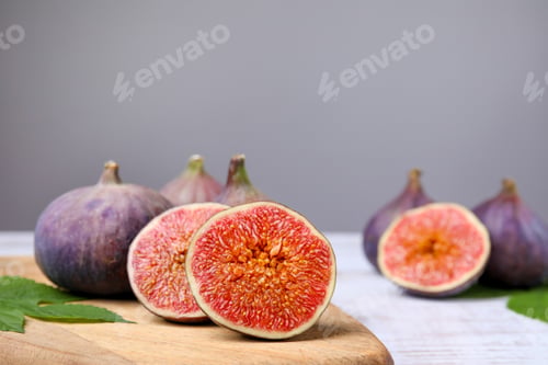 Preview: Fresh ripe figs on white wooden table