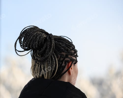 Preview: People from behind. Woman with African braids