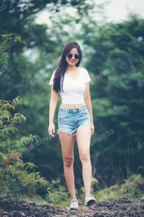 Preview: portrait of young beautiful girl woman happy with nature, against background of mountain and forest