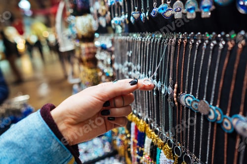 Preview: Young girl tourist walking in the souvenir market