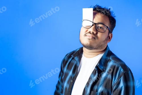 Preview: Indian young man showing business card