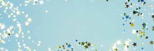 Preview: Holiday Festive background. gold and silver star confetti glitter scattered on blue background.