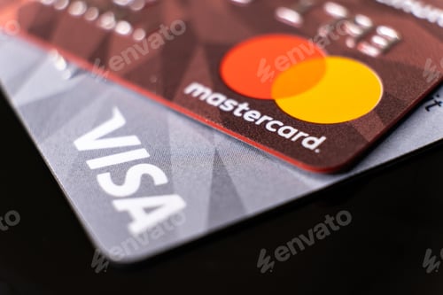 Preview: Mastercard and visa plastic electronic credit cards macro close up. ISTANBUL, TURKEY - February 2022