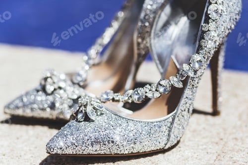 Preview: Expensive shoes with jewelry shine in the sun