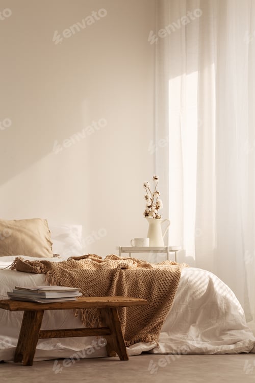 Preview: Wooden stool in front of bed with blanket in natural white bedro