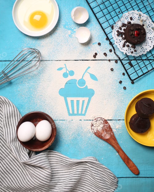 Preview: Top view of a cupcake art with wheat flour with bakery props surrounded