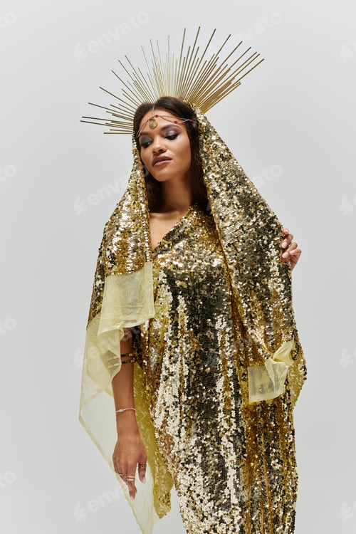 Preview: A stunning African American goddess radiates elegance in a golden dress under studio lights