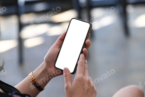 Preview: Close up view businesswoman sitting in office and using smart phone.