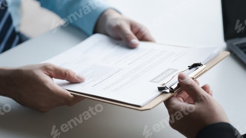 Preview: A person attends a job interview with a manager to join a company, he holds a resume and interview w