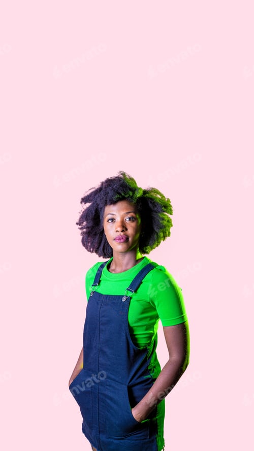 Preview: Young black woman posing isolated staring friendly and relaxed smiling positive