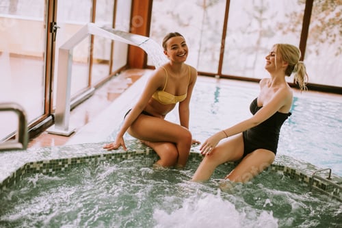Preview: Young women sitting and relaxing by the whirlpool bathtub