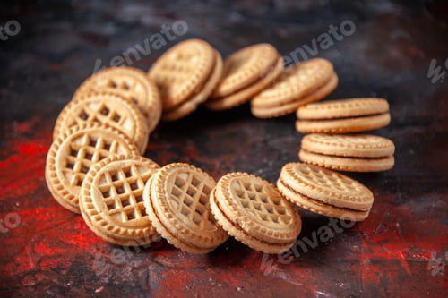 Preview: Top view of tasty sugar cookies arranged in a round form on mix colors background with free space