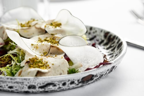 Preview: Traditional Italian appetizer vitello tonnato of thinly sliced marinated veal, seasoned with cream