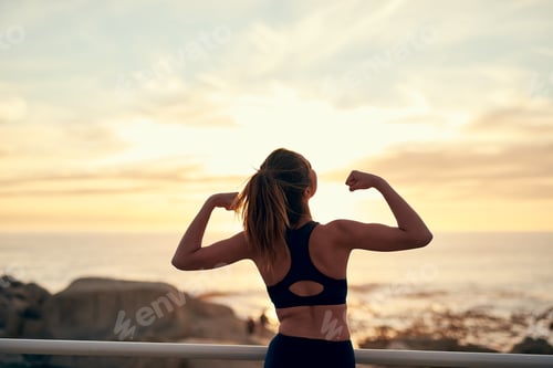 Preview: Shot of a young sporty woman flexing after her workout
