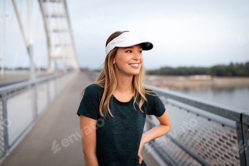 Preview: Portrait of woman taking break from running