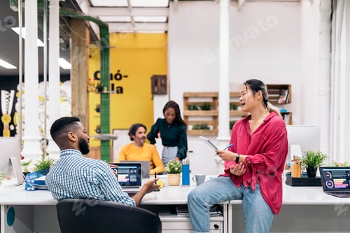 Preview: Happy Coworkers Talking in the Office