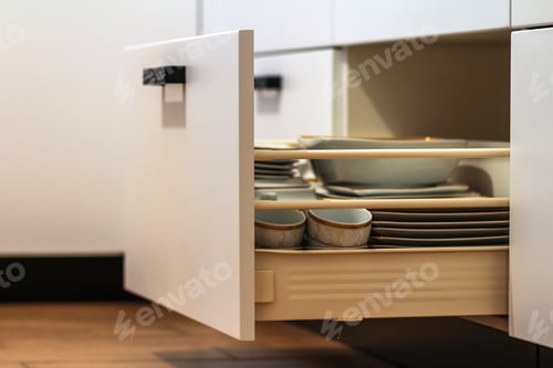 Preview: Open kitchen drawers with plates and cups dishes