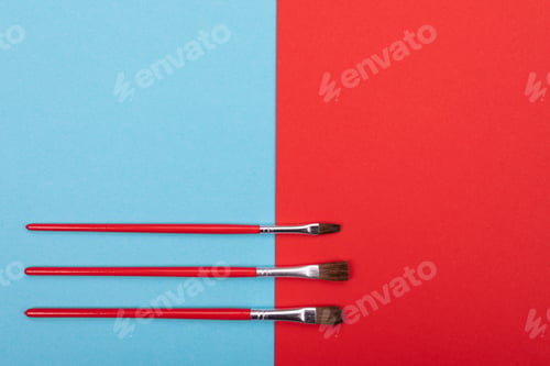 Preview: set of flat artistic paintbrushes on colorful background