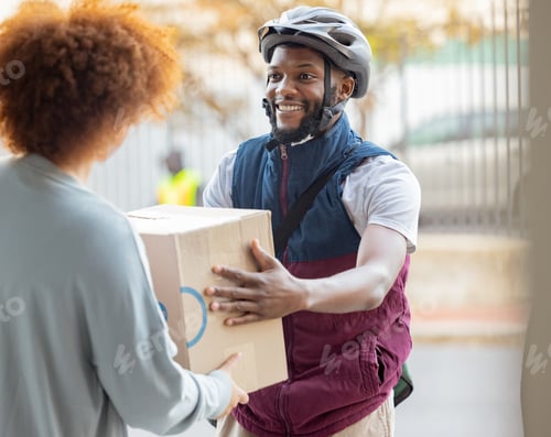 Preview: Black man, smile and delivery with box for black woman at house for logistics, cargo and safety. Yo