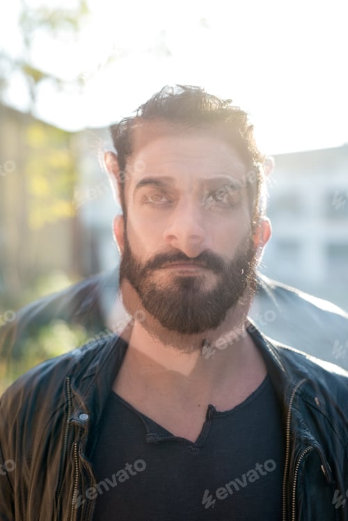Preview: Double exposure young bearded man outdoor using tablet