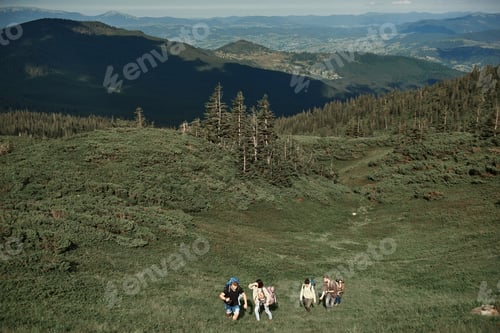 Preview: Top View Of Two Men And Three Women Walking Up Mount. They Backpacking Together In Beautiful