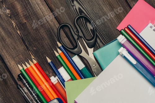 Preview: office desk with stationery and pencils scissors paper markers