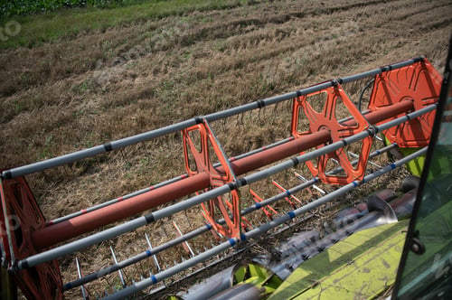 Preview: Combine harvester harvests ripe wheat. agriculture