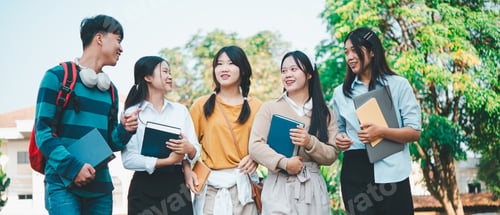 Preview: A group of young people are smiling and holding books