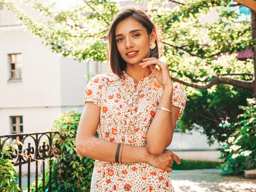 Preview: Portrait of young beautiful woman posing outdoors