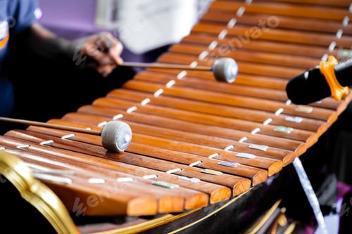Preview: Thai Xylophone 'Ranat' in Musical Performance. An artist's hands playing traditional Thai xylophone