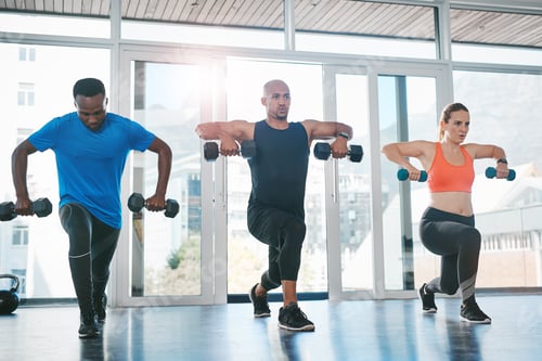 Preview: Working out with others makes it easy to stay motivated. Shot of people working out in the gym.