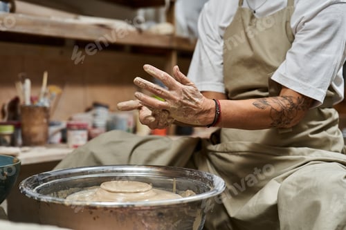 Preview: Artistic expression in clay during pottery session at a serene studio filled with creative energy