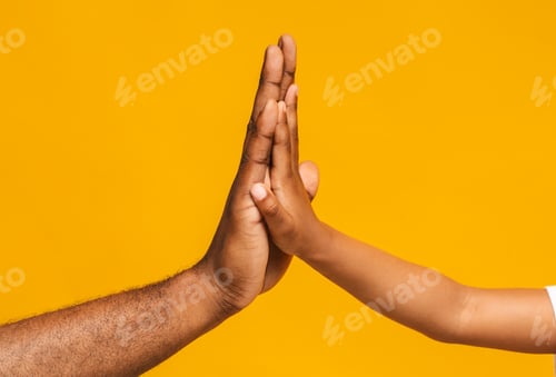 Preview: High five gesture of african father and child