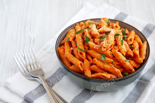 Preview: Homemade Penne Alla Vodka from Leftover Sauce with Cheese and Parsley, low angle view.