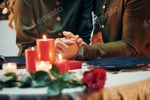 Preview: Conception of relationships. Young lovely couple have romantic dinner indoors together